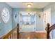 Hallway view features a large window and entry to bedroom with desk at 2024 Stanchion St, Haw River, NC 27258