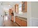 Kitchen with wooden cabinetry and granite countertops, stainless steel appliances, and hardwood flooring at 2024 Stanchion St, Haw River, NC 27258