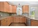 Modern kitchen with ample counter space, stainless steel appliances, and view of the living spaces at 2024 Stanchion St, Haw River, NC 27258