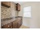 Laundry room featuring a window and stylish backsplash at 2024 Stanchion St, Haw River, NC 27258