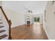 Spacious living room featuring hardwood floors, a fireplace, and sliding glass doors to the outdoor space at 2024 Stanchion St, Haw River, NC 27258
