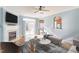 Cozy living room with fireplace, large windows, and access to the backyard at 2024 Stanchion St, Haw River, NC 27258