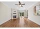 Bright living room with hardwood floors, fireplace, sliding glass doors, and access to a kitchen view at 2024 Stanchion St, Haw River, NC 27258