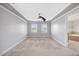 Main bedroom features carpet, a ceiling fan and an attached bathroom at 2024 Stanchion St, Haw River, NC 27258