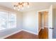 An empty room with wood floors and a window, perfect for a home office or guest room at 2024 Stanchion St, Haw River, NC 27258