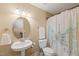 Clean bathroom with pedestal sink, toilet, and shower at 454 Big Willow Way, Rolesville, NC 27571