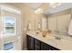 Bathroom boasts double vanity and access to a toilet area at 454 Big Willow Way, Rolesville, NC 27571