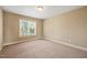 Bright bedroom with neutral walls and carpet flooring at 454 Big Willow Way, Rolesville, NC 27571