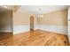 Bright dining room with hardwood floors, crown molding, and large window at 454 Big Willow Way, Rolesville, NC 27571