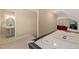 Fun game room with air hockey, bathroom, and sitting area at 454 Big Willow Way, Rolesville, NC 27571