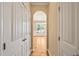 Elegant hallway with arched doorway leading to the dining room at 454 Big Willow Way, Rolesville, NC 27571