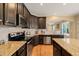 Modern kitchen with granite countertops and stainless steel appliances at 454 Big Willow Way, Rolesville, NC 27571
