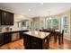 Kitchen with island, breakfast nook, and ample cabinet space at 454 Big Willow Way, Rolesville, NC 27571