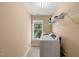Bright laundry room features washer, dryer, and ample shelving at 454 Big Willow Way, Rolesville, NC 27571