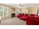 Living room boasts a fireplace and sectional sofa at 454 Big Willow Way, Rolesville, NC 27571