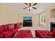 Bright living room featuring a sectional sofa and large TV at 454 Big Willow Way, Rolesville, NC 27571
