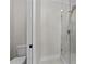Modern bathroom with a glass-enclosed shower and tile surround at 811 Maple Berry Ln # 101, Raleigh, NC 27607