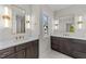 Elegant bathroom with dual vanities, quartz counters, and modern lighting fixtures at 811 Maple Berry Ln # 101, Raleigh, NC 27607