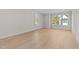 Bright bedroom with hardwood floors and two large windows at 811 Maple Berry Ln # 101, Raleigh, NC 27607