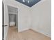 Light-filled bedroom with hardwood floors and a view into an unfinished attic space at 811 Maple Berry Ln # 101, Raleigh, NC 27607