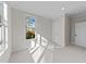Neutral bedroom with a window, recessed lights, and two doors at 811 Maple Berry Ln # 101, Raleigh, NC 27607