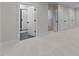 Spacious bedroom with neutral carpeting, a view into the bathroom, and closet storage at 811 Maple Berry Ln # 101, Raleigh, NC 27607