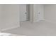 Clean bedroom with neutral colored carpet and walls, and two doors at 811 Maple Berry Ln # 101, Raleigh, NC 27607