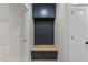 Entryway with a custom hall tree featuring cabinets, drawers, a wooden bench, and gold-toned hooks at 811 Maple Berry Ln # 101, Raleigh, NC 27607