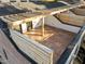 A private roof deck featuring wood floors and pergola-style overhead invites outdoor living and entertaining at 811 Maple Berry Ln # 101, Raleigh, NC 27607