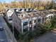An aerial view showing the home with a rooftop deck and a pergola at 811 Maple Berry Ln # 102, Raleigh, NC 27607