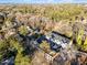 An aerial view of newly built townhomes nestled in a community with mature trees and landscaping at 811 Maple Berry Ln # 102, Raleigh, NC 27607