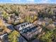 An aerial view of newly built townhomes in a neighborhood with mature trees, located near the city at 811 Maple Berry Ln # 102, Raleigh, NC 27607