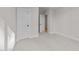 Bedroom showcasing neutral walls, white trim, neutral carpet, and closets for storage at 811 Maple Berry Ln # 102, Raleigh, NC 27607