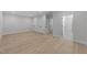 Bright bedroom featuring light hardwood floors, white walls, and multiple closets for ample storage at 811 Maple Berry Ln # 102, Raleigh, NC 27607
