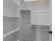 Walk-in closet with multiple shelves and rods for storage at 811 Maple Berry Ln # 102, Raleigh, NC 27607
