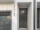 A front door view of the newly built townhome with a black door, white trim and the unit's numbers at 811 Maple Berry Ln # 102, Raleigh, NC 27607