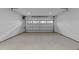 Spacious one-car garage features concrete floors, bright white walls, and an automatic door at 811 Maple Berry Ln # 102, Raleigh, NC 27607