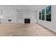Spacious living room featuring a fireplace, custom built-ins, and lots of natural light at 811 Maple Berry Ln # 102, Raleigh, NC 27607