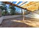 Outdoor deck area with patterned wood flooring and wood beam pergola overlooking beautiful trees at 811 Maple Berry Ln # 102, Raleigh, NC 27607