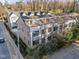 Aerial view of a newly constructed townhouse complex featuring modern designs and landscaping at 811 Maple Berry Ln # 103, Raleigh, NC 27607
