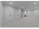 Spacious bedroom with neutral walls, recessed lighting, and multiple closet doors for ample storage at 811 Maple Berry Ln # 103, Raleigh, NC 27607