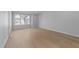 A new bedroom features wood floors, a window to allow natural light, and neutral paint on the walls at 811 Maple Berry Ln # 103, Raleigh, NC 27607