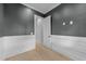 Cozy bedroom showcasing wainscoting and new hardwood floors at 811 Maple Berry Ln # 103, Raleigh, NC 27607
