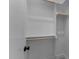 Walk-in closet with white walls, wooden railings, and carpeted floors; storage opportunity for organizing clothes and accessories at 811 Maple Berry Ln # 103, Raleigh, NC 27607