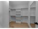 Large walk-in closet with built-in shelving provides ample storage space at 811 Maple Berry Ln # 103, Raleigh, NC 27607