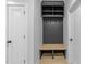 Functional entryway with a built-in bench, storage cubbies, coat hooks, and light wood flooring at 811 Maple Berry Ln # 103, Raleigh, NC 27607