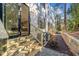 A modern townhouse showing the exterior, back entrance, landscaping and outdoor living space with small patio at 811 Maple Berry Ln # 103, Raleigh, NC 27607