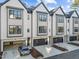 Charming townhome showcasing modern design with neutral colors, an attached garage, and a well-kept driveway at 811 Maple Berry Ln # 103, Raleigh, NC 27607