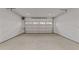 Spacious and clean garage featuring a bright interior with concrete flooring and white walls at 811 Maple Berry Ln # 103, Raleigh, NC 27607