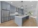 Spacious kitchen with stainless steel appliances and a large island at 811 Maple Berry Ln # 103, Raleigh, NC 27607